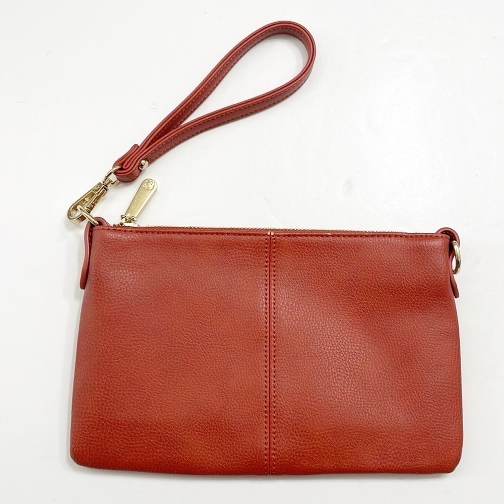 Charming Charlie burnt orange wristlet